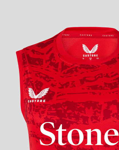 Close up of the red sleeveless tee neckline showing Castore branding and size label inside