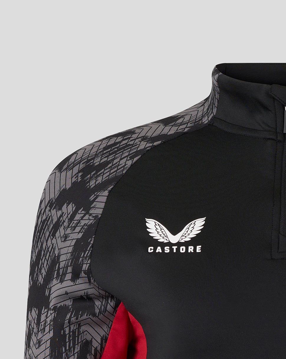 Close-up of black training top with Castore logo on the chest and grey geometric shoulder pattern