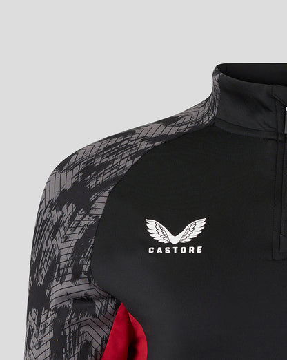 Close-up of black training top with Castore logo on the chest and grey geometric shoulder pattern
