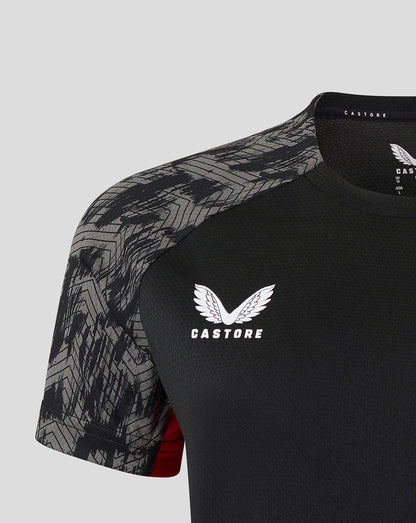 Close up of chest showing Castore logo on black Saracens training tee with gray patterned sleeves
