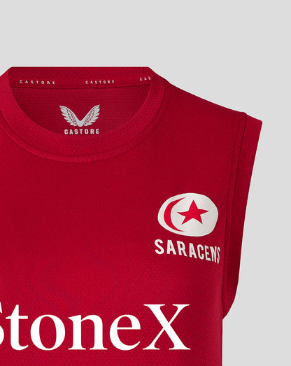 Front close up of red Saracens training vest showing crest and StoneX sponsor text.