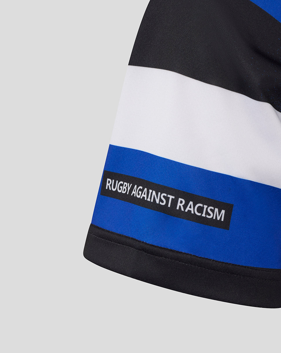 Close up of Bath Rugby home shirt sleeve showing blue white black stripes and Rugby Against Racism label