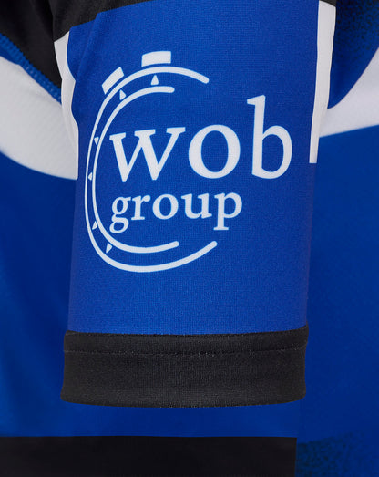 Sleeve detail of Bath Rugby replica shirt with blue sleeve and white wob group logo