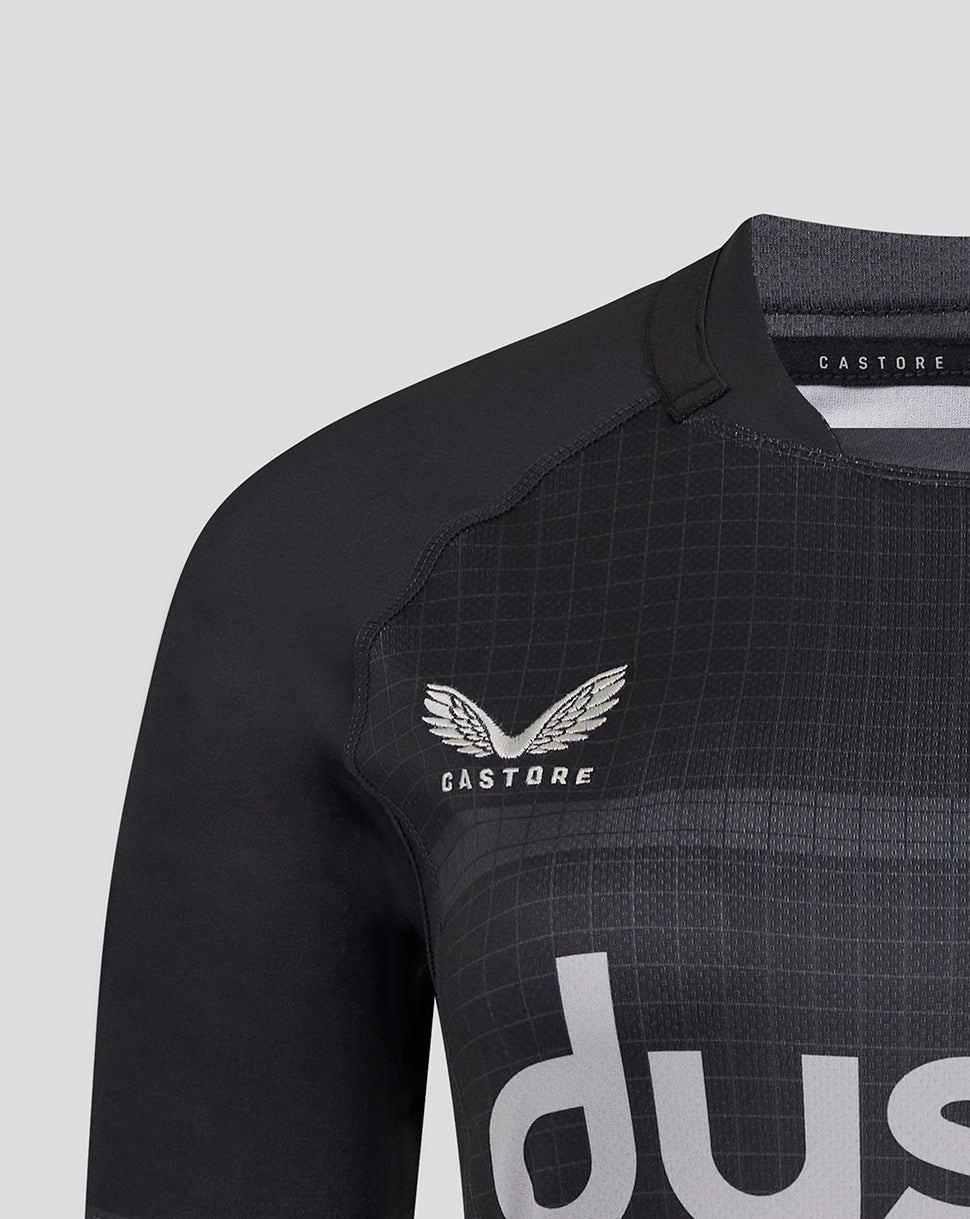 Detail of Bath Rugby crest on black jersey with grid pattern and shoulder seam