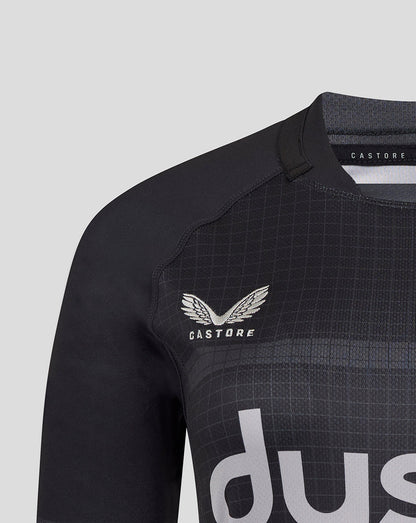 Detail of Bath Rugby crest on black jersey with grid pattern and shoulder seam