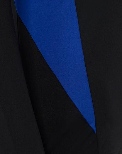 Close-up detail of Bath Rugby midlayer showing black fabric with a bold blue diagonal panel.