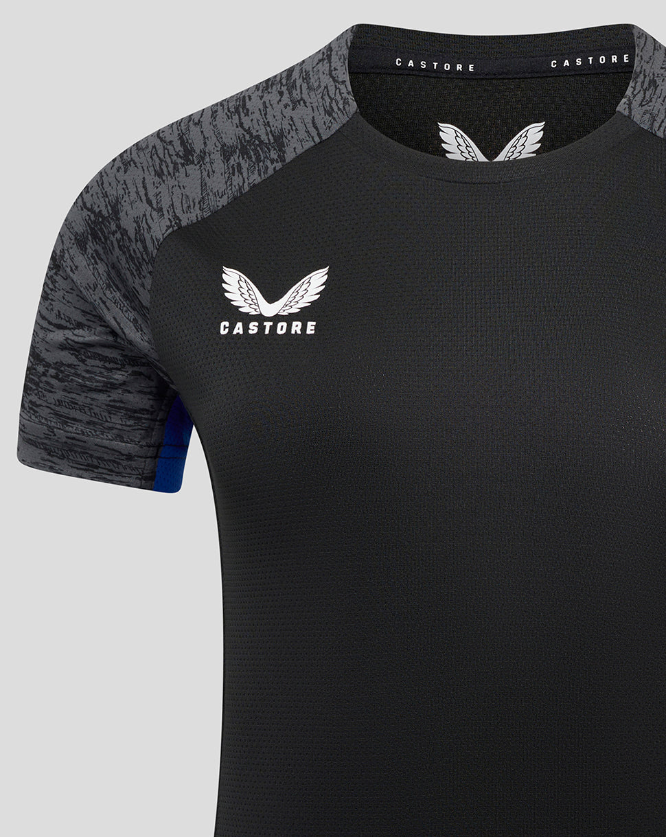 Close-up of chest area showing Castore logo and Bath Rugby crest on black training tee with grey patterned sleeves