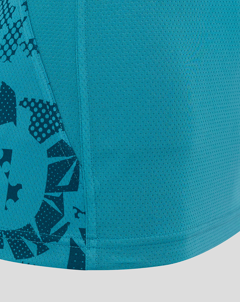 Close up of sleeve and side panel with abstract print on Storm Blue England Rugby Women’s performance T shirt