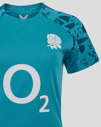 Front close up of England Rugby Women’s Storm Blue performance T shirt showing white rose crest on left chest and large O2 logo on center front with Castore branding on right chest