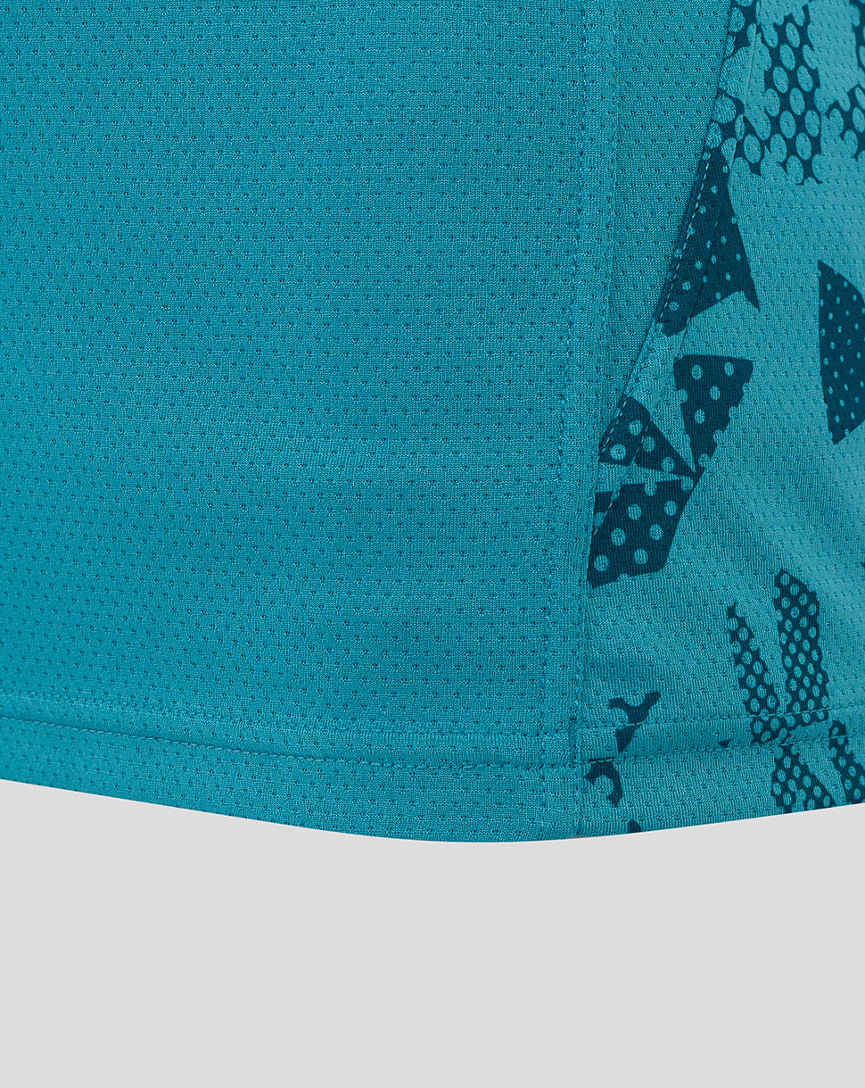 Close up of storm blue performance fabric with dotted texture and abstract side panel print from Women's England Rugby sleeveless T shirt