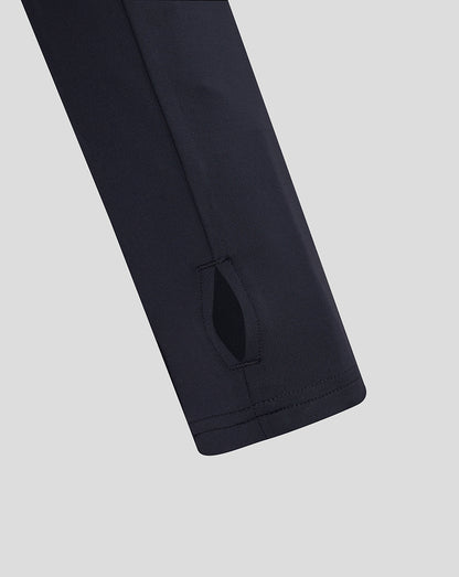 Close up of navy England Rugby performance midlayer sleeve with side panel detail.