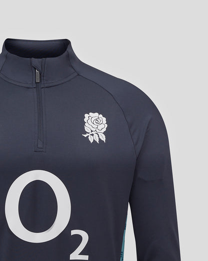 Close-up of navy midlayer showing white rose crest on left chest and large O2 graphic on the front