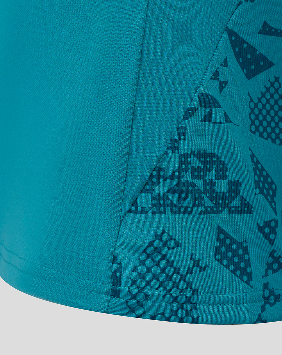 Storm blue fabric close-up showing an angled printed side panel from the Women's England Rugby Performance Long Sleeve Midlayer Top