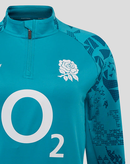 Close-up of funnel neck and quarter-zip on storm blue midlayer showing rose crest left chest O2 center and Castore right chest