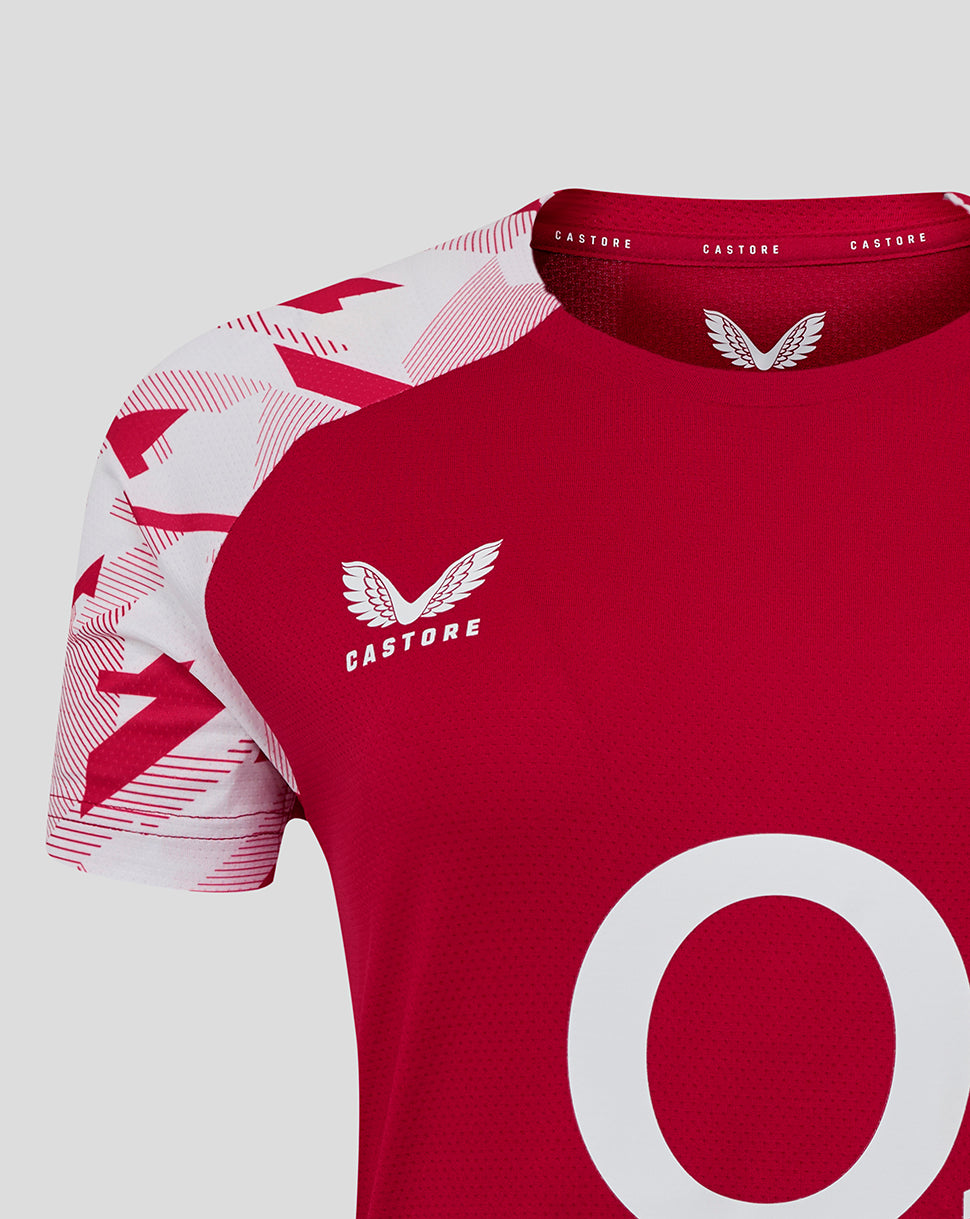 Close up of shoulder and chest showing white geometric sleeve print and Castore logo on red England Rugby shirt