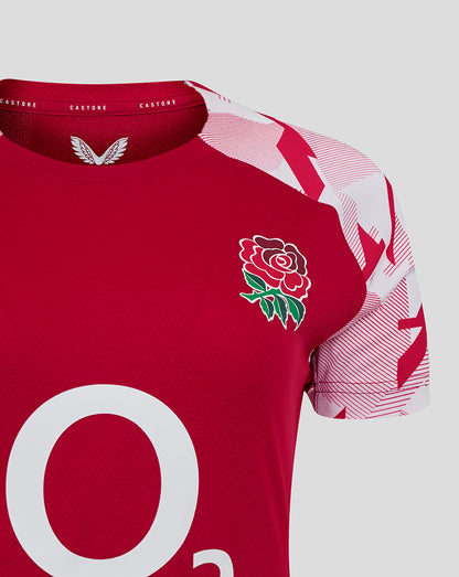 Close up of the England Rugby Red Roses pre match short sleeve shirt with rose crest on the left chest and O2 logo at center.