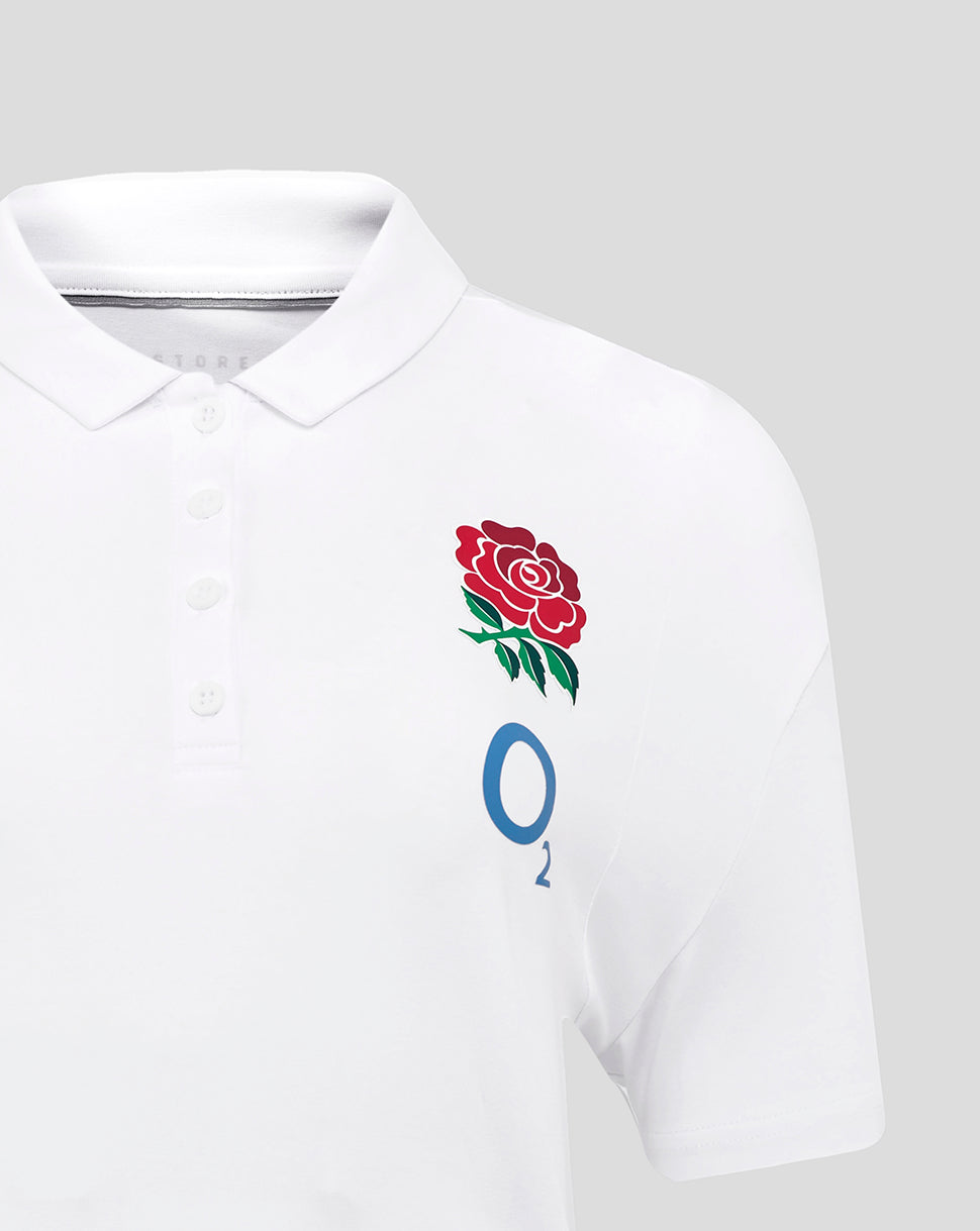 Close up of polo chest with the red England rose crest on the left and blue O2 logo on the right.