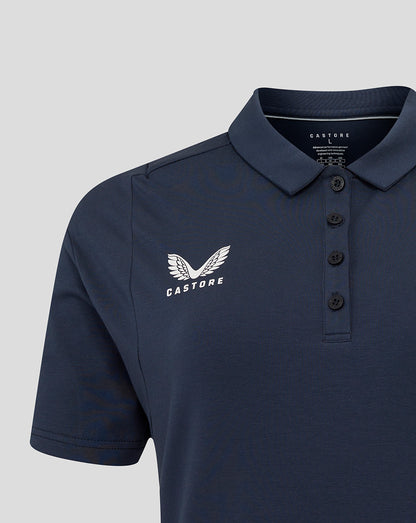 Close-up of navy Travel Polo highlighting Castore branding on left chest and button placket