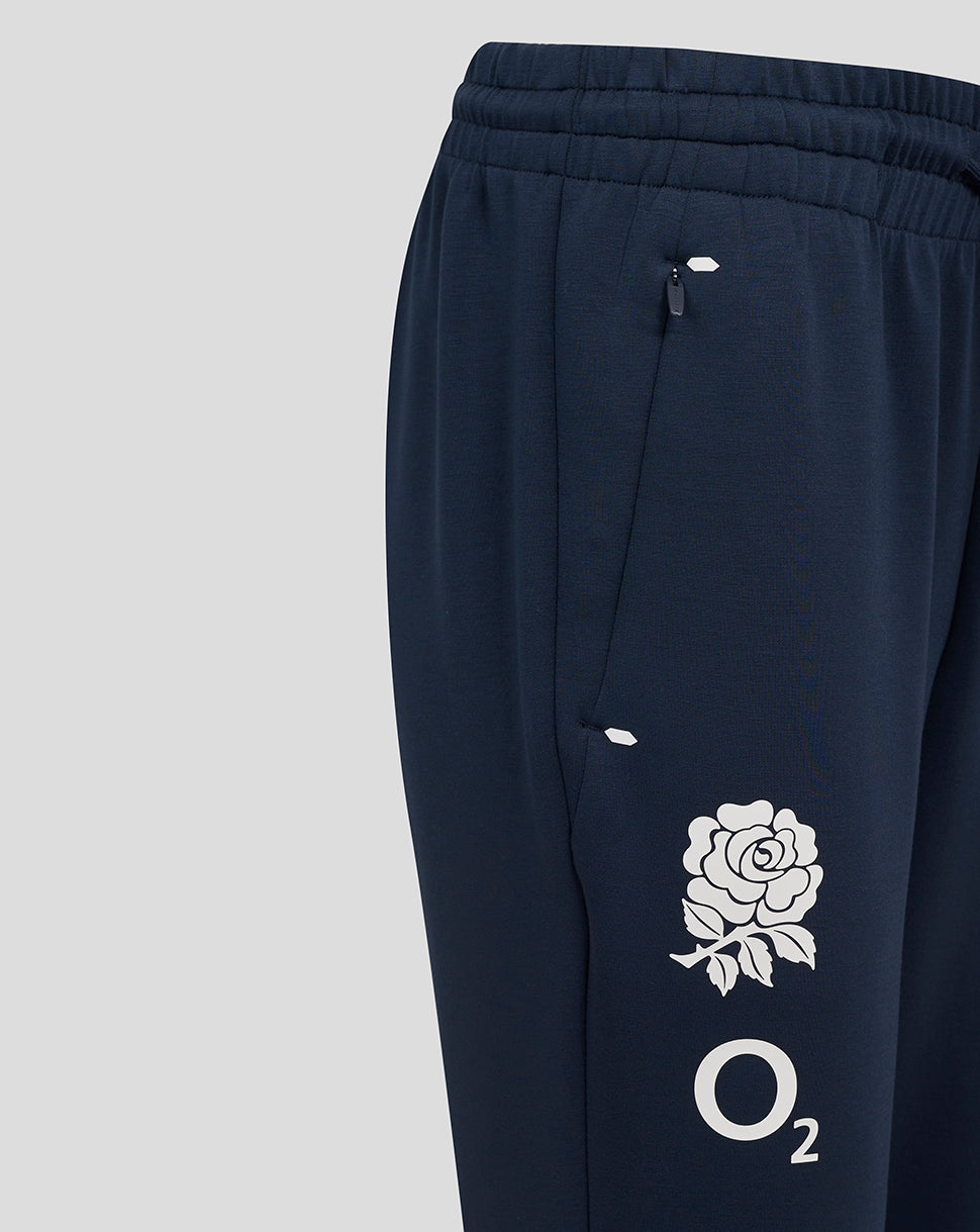 Navy England Rugby Travel Knit Pant close-up showing a side zip pocket and white rose O2 logo on the thigh