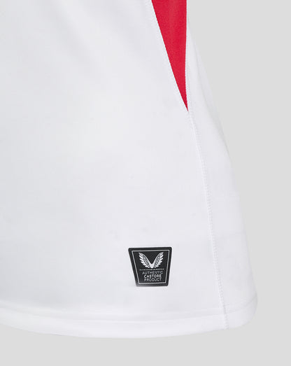 Close-up of the shirt hem showing the authentic Castore Product label on white fabric.
