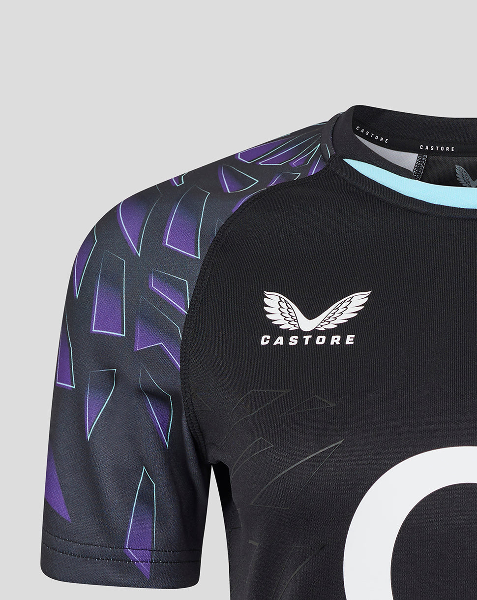 Shoulder and chest area of black rugby shirt with purple patterned sleeves and Castore branding at the neck