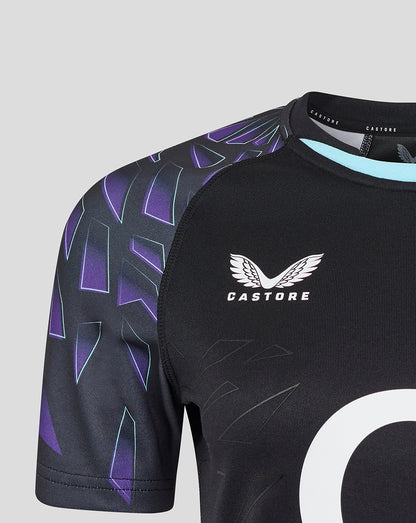 Shoulder and chest area of black rugby shirt with purple patterned sleeves and Castore branding at the neck