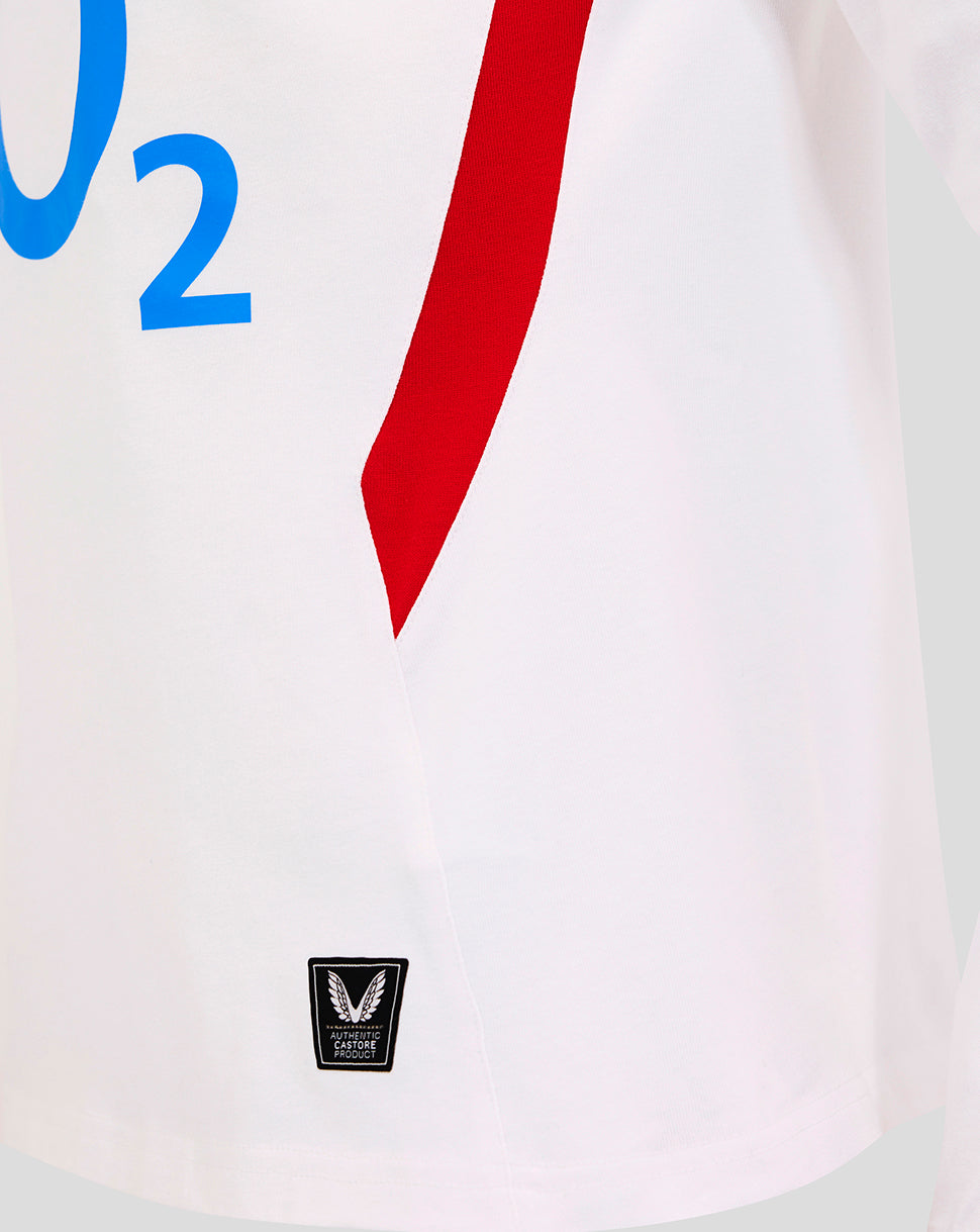 Close-up of the white England Rugby home long sleeve shirt showing a bold red side panel and a small Castore badge near the hem
