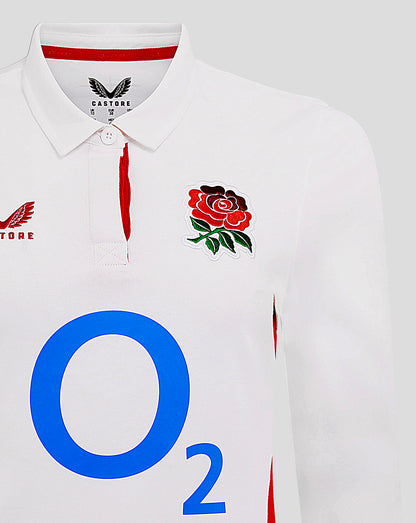 Close-up of white England rugby shirt collar and chest showing Castore logo, rose crest, and red placket