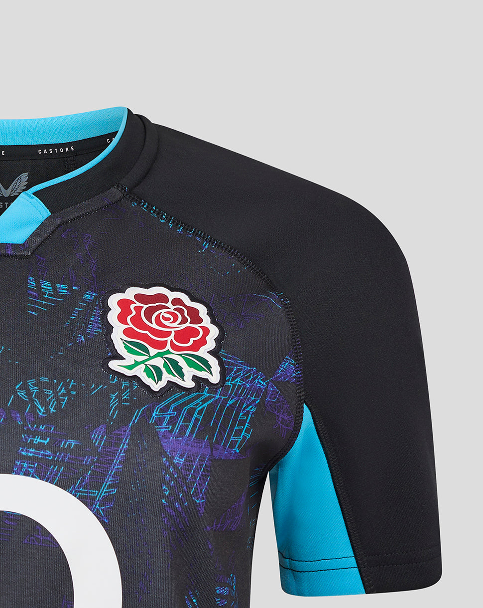 Close-up of Womens England Rugby Alternate shirt in black with blue collar, rose crest on left chest, O2 logo center and Castore branding on right chest.
