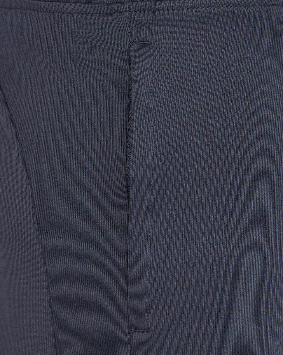 Close-up of navy knit shorts fabric with a vertical seam line and neat stitching