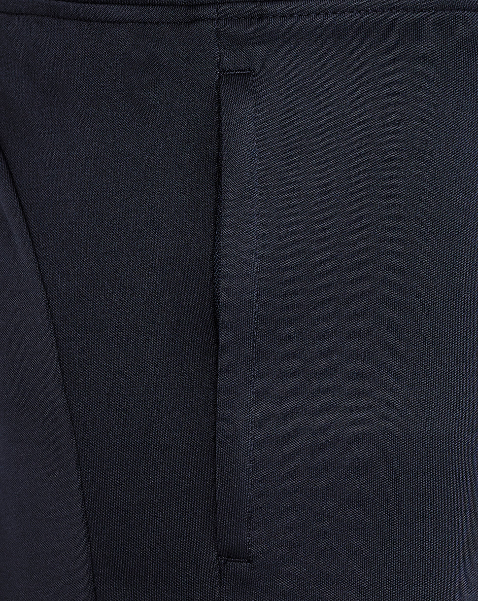 Close-up of the waistband area on navy knit shorts showing stitching and seam detail