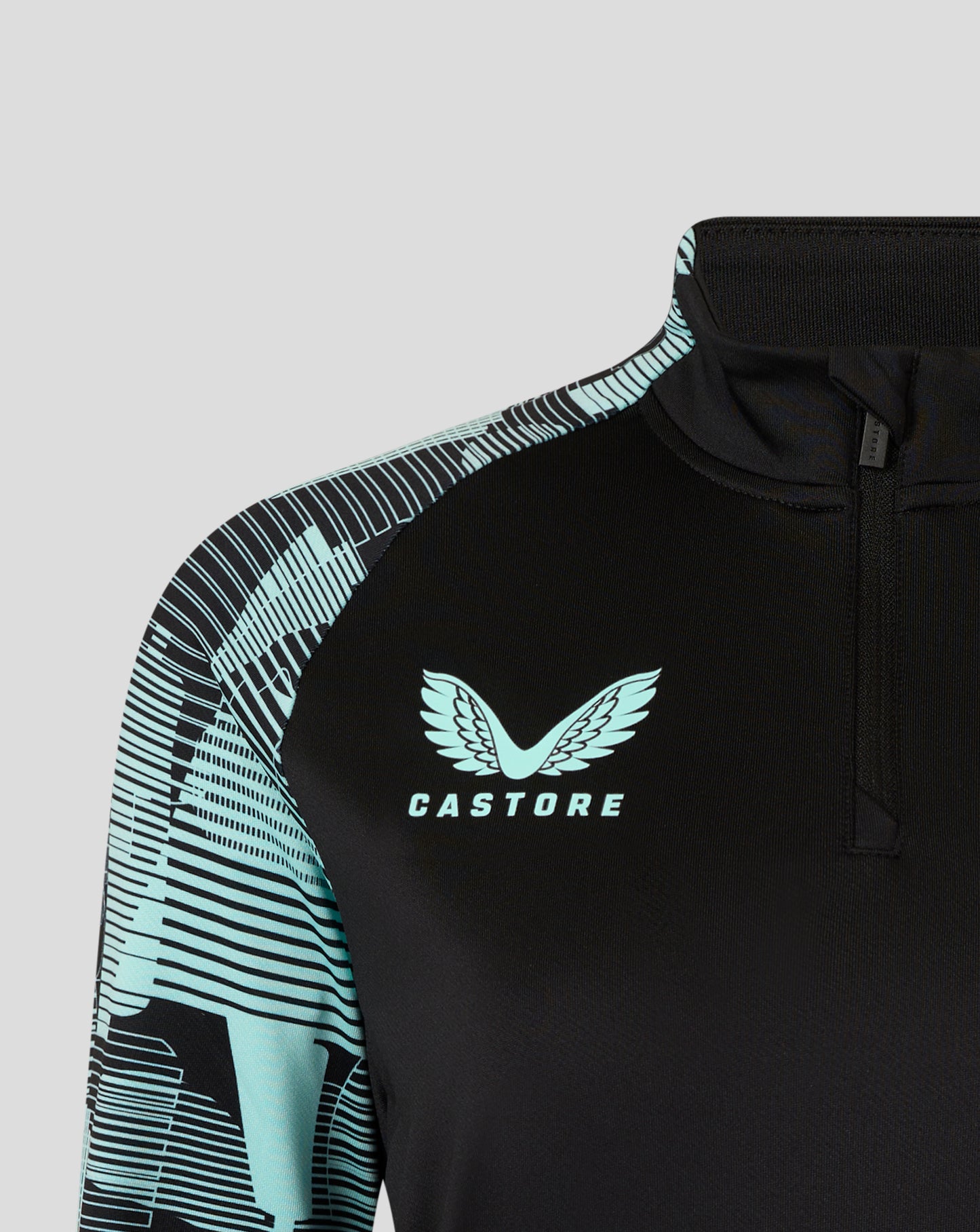 Shoulder and collar view of the black England Ashes Pro Quarter Zip Training Top with turquoise geometric sleeve design