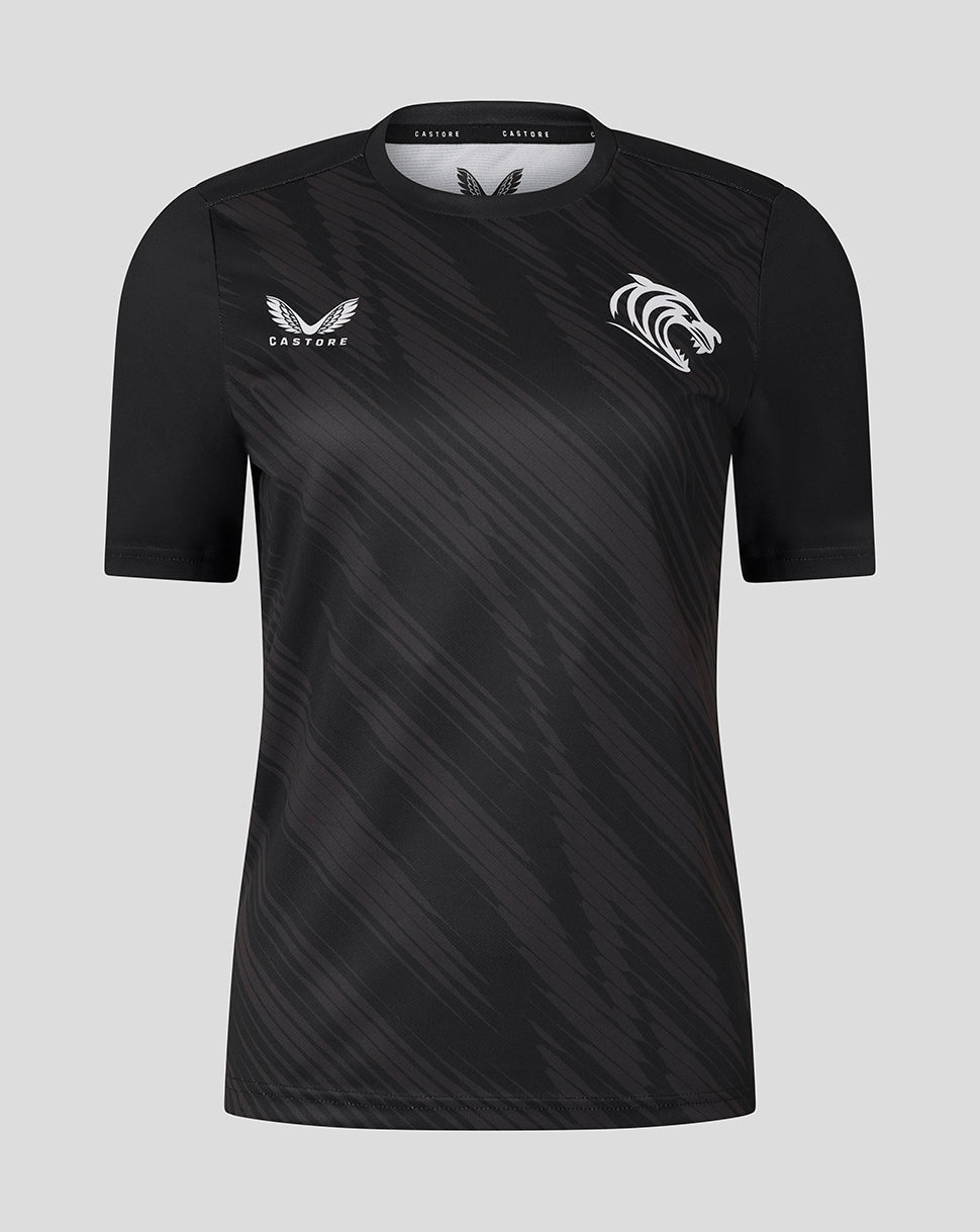 Front view of black Leicester Tigers women's warm up T shirt with diagonal pattern and white team crest on the chest
