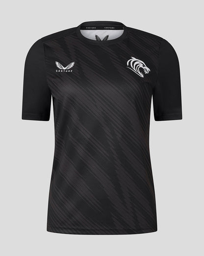 Front view of black Leicester Tigers women's warm up T shirt with diagonal pattern and white team crest on the chest