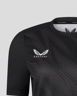Shoulder and chest close up of black Leicester Tigers women's warm up T shirt showing Castore branding and tiger crest