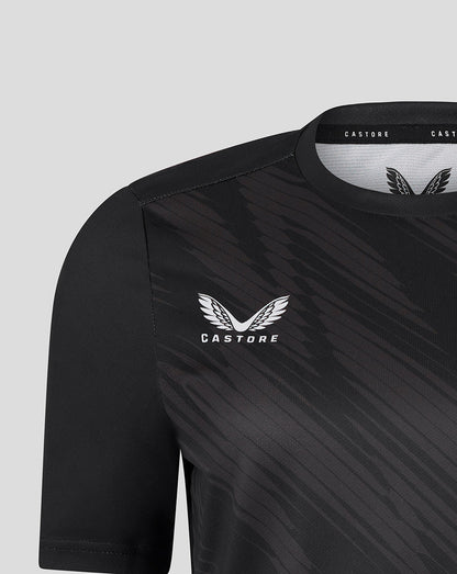 Shoulder and chest close up of black Leicester Tigers women's warm up T shirt showing Castore branding and tiger crest