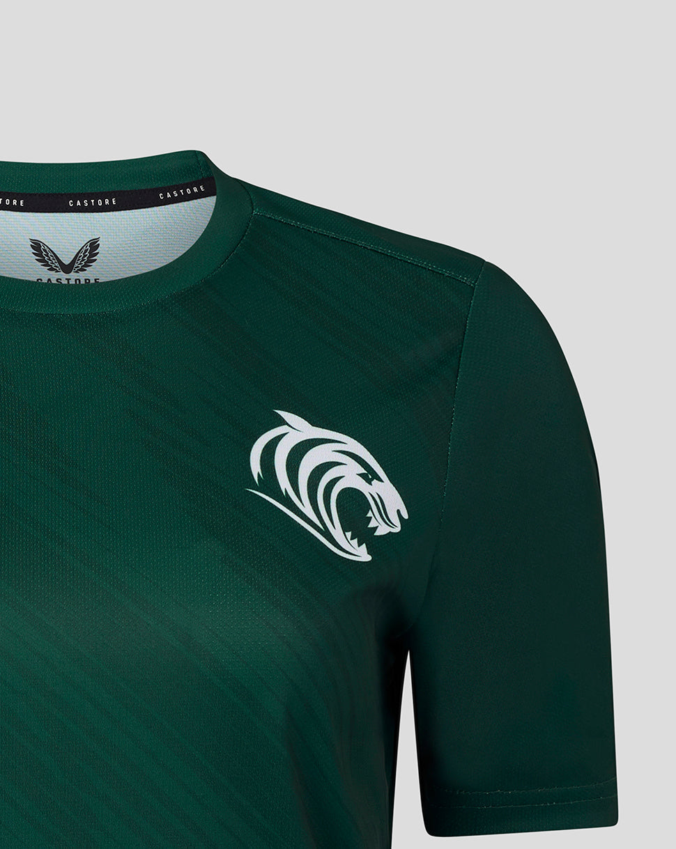 Front view of dark green Leicester Tigers women's 25/26 warm up T shirt showing a white tiger head logo on the chest