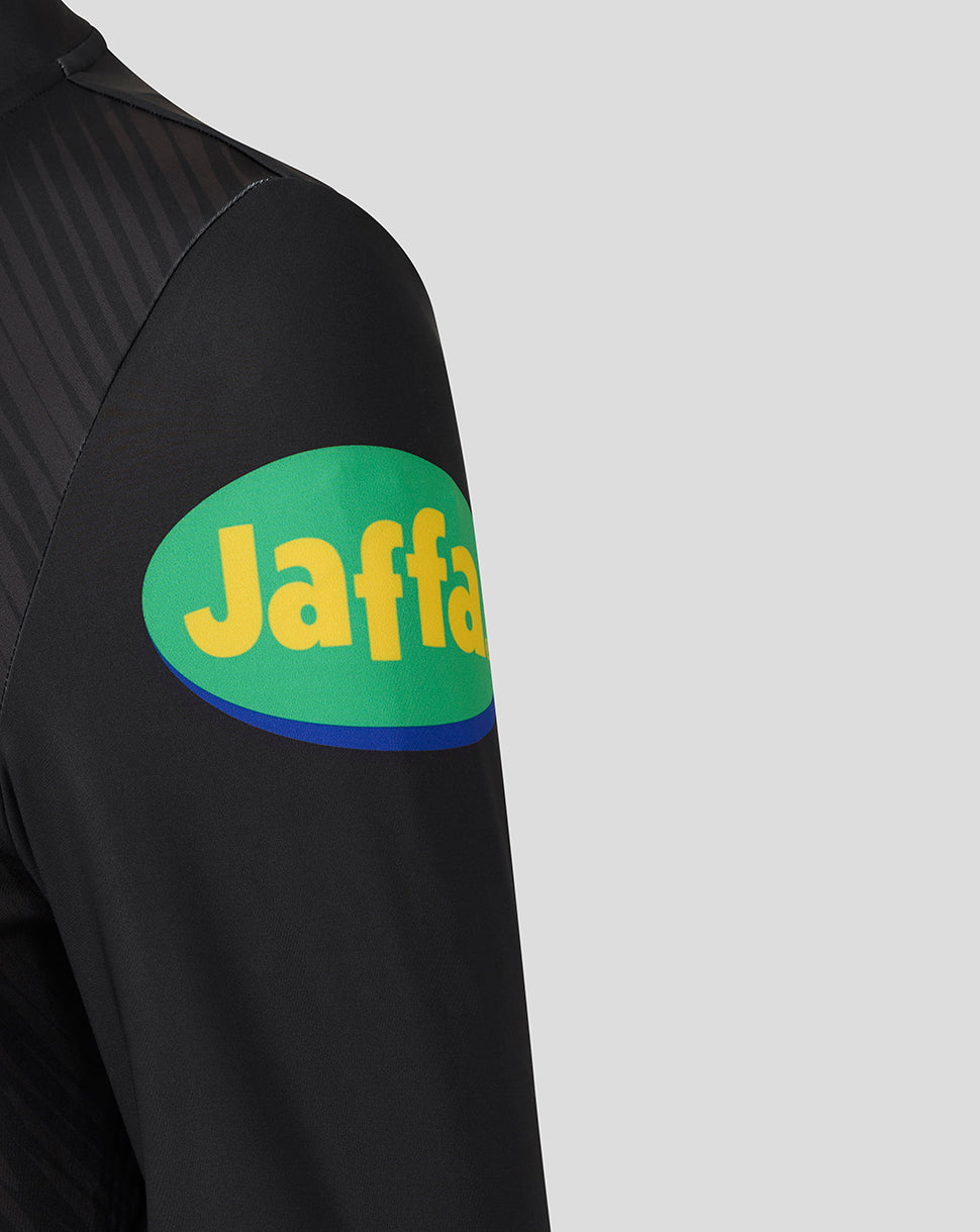 Sleeve of the black training top featuring a green and yellow Jaffa sponsor patch