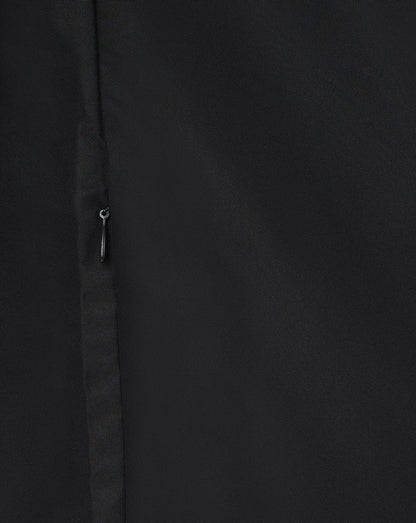 Close up of black woven fabric with a small zipper pull from the Leicester Tigers women's pre match jacket