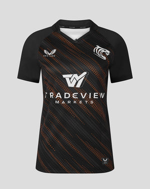 Front view of Leicester Tigers 25/26 Warm Up Jersey in black with orange diagonal pattern and white tiger crest.