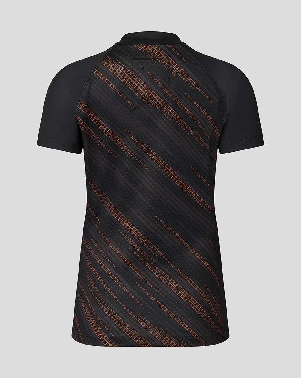 Back view of black Leicester Tigers Women's 25/26 warm up jersey featuring an orange diagonal pattern
