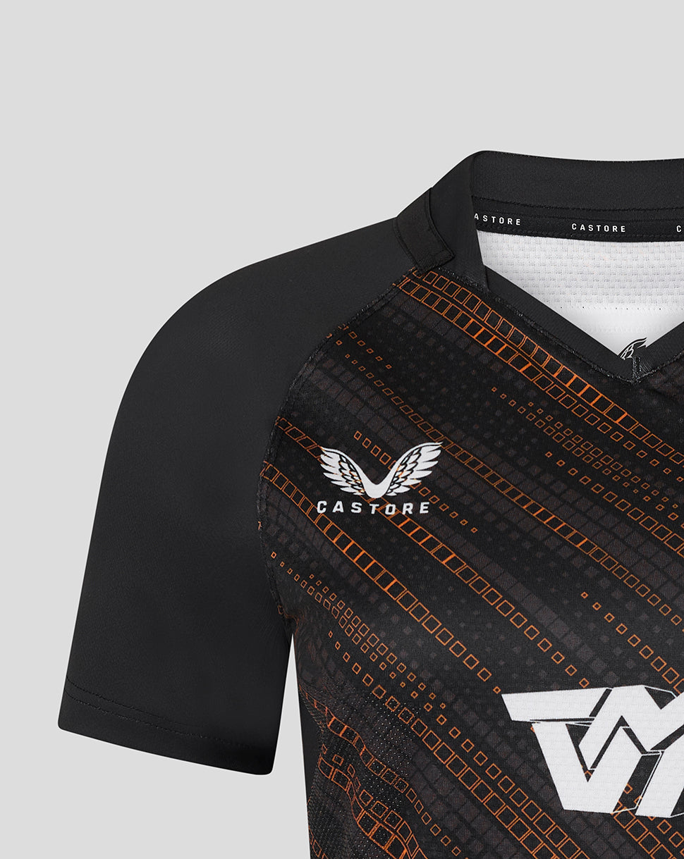 Close up of left chest showing tiger head crest and orange diagonal pattern on black warm up jersey.