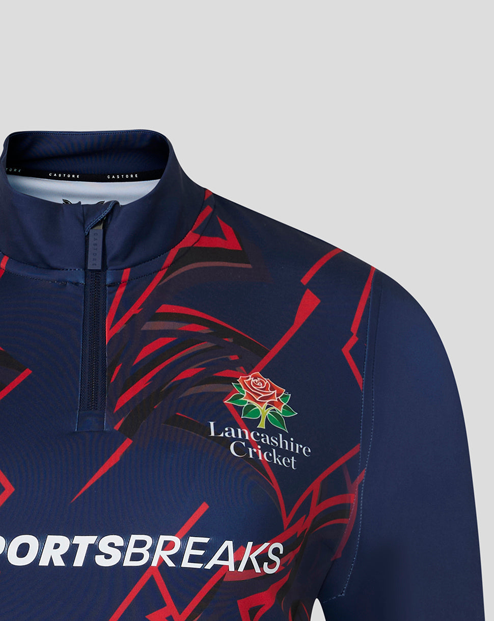 Front close-up of navy Lancashire Cricket quarter zip featuring crest and red graphic pattern
