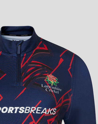 Front close-up of navy Lancashire Cricket quarter zip featuring crest and red graphic pattern