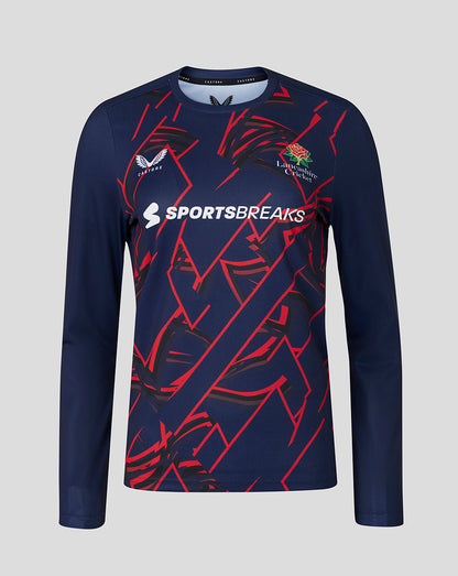 Front view of Lancashire Cricket women's 26/27 long sleeve performance T shirt in peacoat with red geometric graphics and SPORTSBREAKS logo