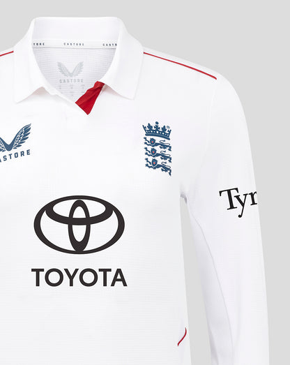 Close-up of the white Test Pro cricket shirt neck showing England crest, red inner placket, and Toyota logo on the chest.