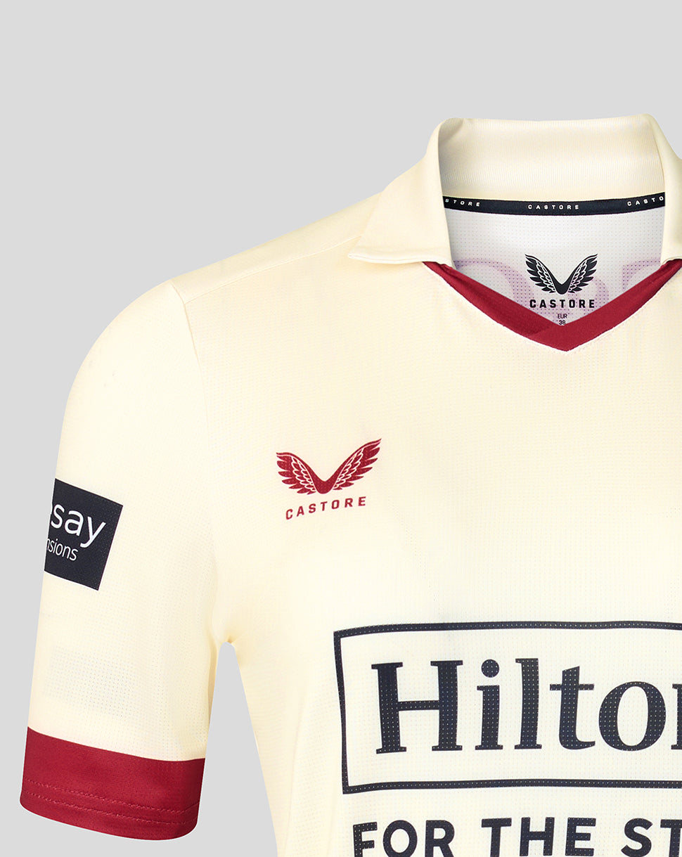 Front view of cream Lancashire County Champs jersey showing Hilton sponsor on chest, Castore logo, and maroon V-neck trim