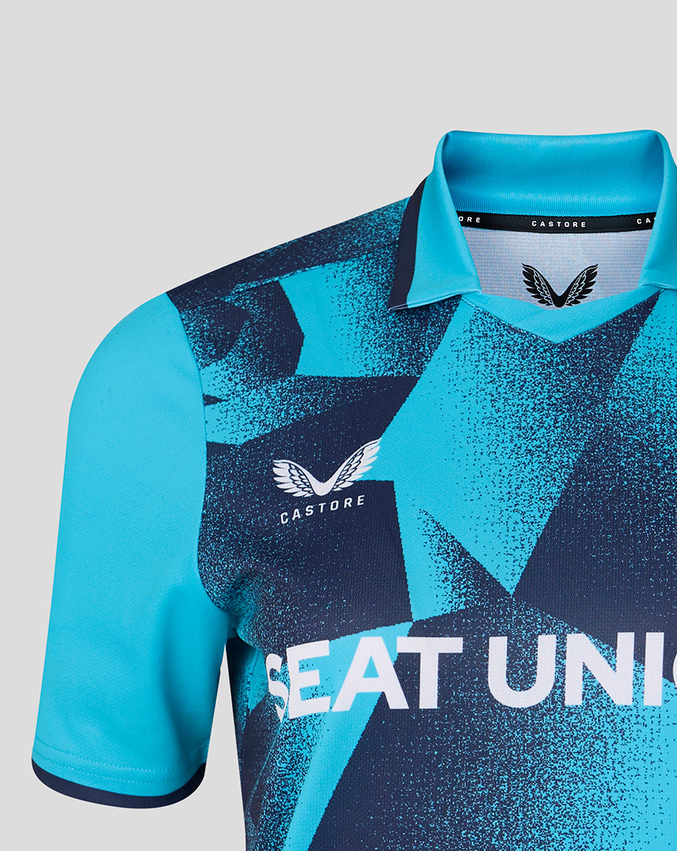 Close-up of Yorkshire Cricket Women's Aquarius ODI jersey with bold blue geometric pattern and Castore branding