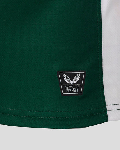 Lower hem of the Leicester Tigers shirt with authentic Castore product patch on green fabric