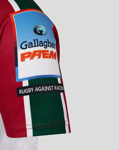 Close up of the jersey sleeve with Gallagher Premiership and Rugby Against Racism patches on red green and white stripes.